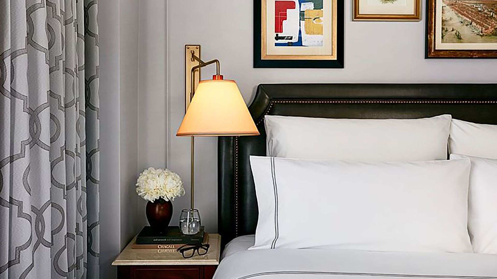 A Bed With A Lamp And A Lamp On The Side